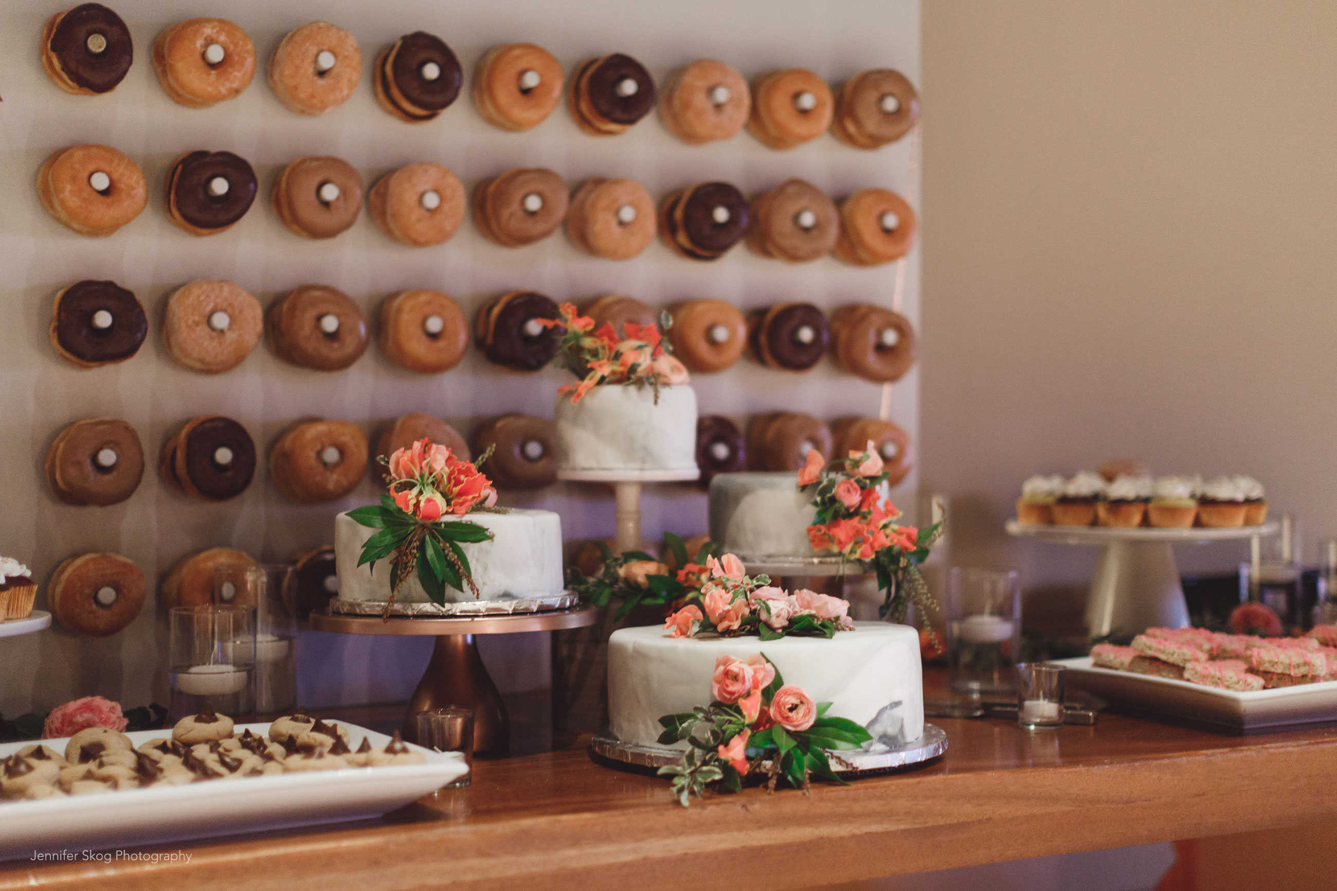 Wedding cakes, cupcakes and donut wall at Casa Real at Ruby Hill Winery (www.casarealevents.com).  Photo by: Jennifer Skog Photography; Cakes and Cupcakes: Cakes by Bev; Florals: Nicole Ha Design